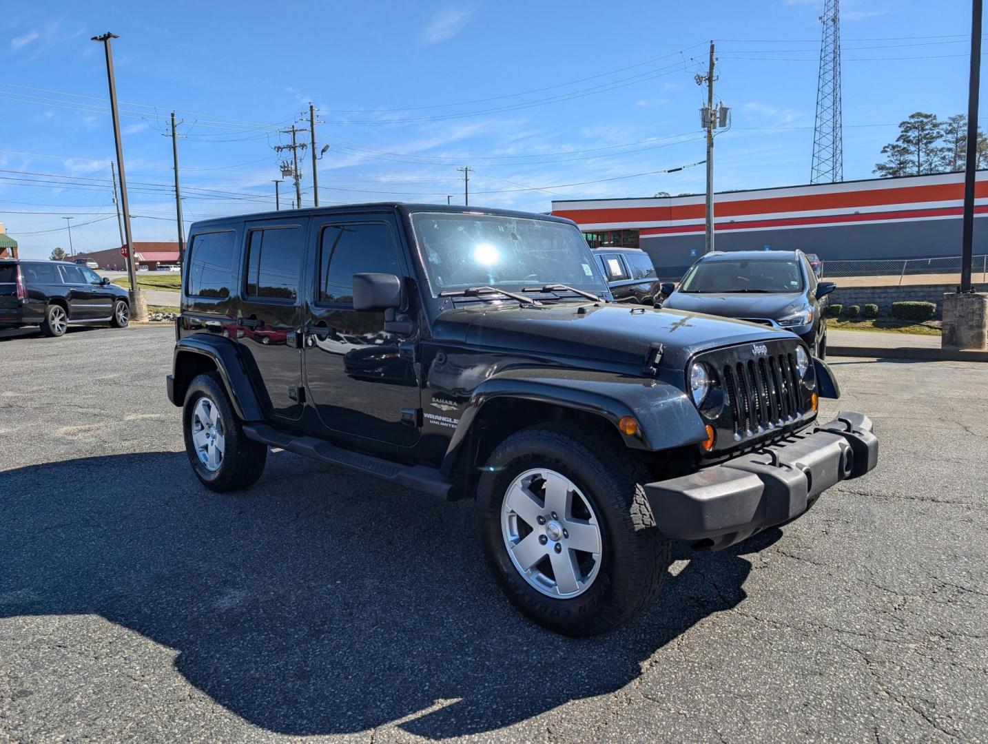 2012 Black /Black Interior Jeep Wrangler Unlimited Sahara (1C4BJWEG5CL) with an Gas V6 3.6L/220 engine, 5-Speed Automatic transmission, located at 521 Old Farm Lane Rd, Prattville, AL, 36066, (334) 325-1505, 32.482460, -86.416367 - 2012 Jeep Wrangler Unlimited Sahara - Photo#2