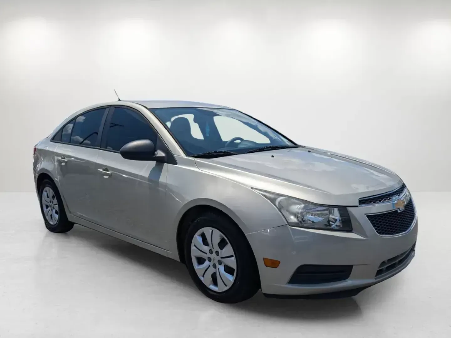 2013 Champagne Silver Metallic /Jet Black/Medium Titanium Chevrolet Cruze LS (1G1PA5SH9D7) with an Other engine, located at 7000 Northlake Connector, Columbus, GA, 31904, (706) 987-8085, 32.524975, -84.978134 - **Discover Your Perfect Daily Driver at Gils Auto in Phenix City!**<br /> <br /> Are you on the hunt for a reliable, fuel-efficient sedan that fits seamlessly into your busy lifestyle? Look no further! The 2013 Chevrolet Cruze LS is the ideal choice for those who value comfort, affordability, and st - Photo#2