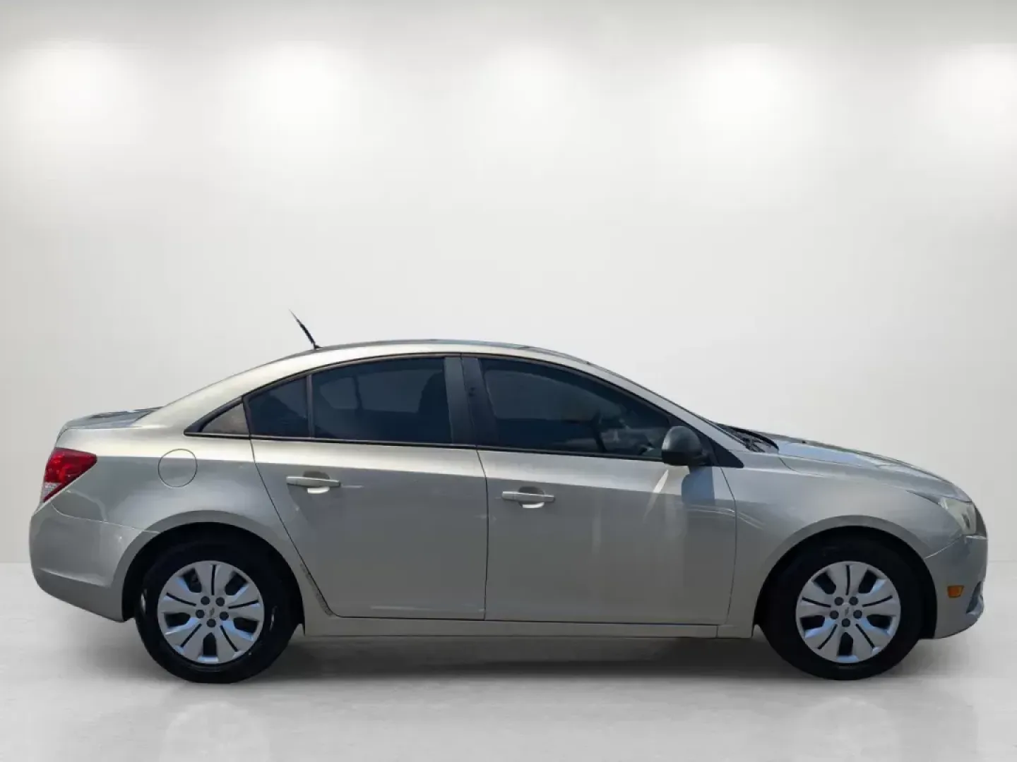 2013 Champagne Silver Metallic /Jet Black/Medium Titanium Chevrolet Cruze LS (1G1PA5SH9D7) with an Other engine, located at 7000 Northlake Connector, Columbus, GA, 31904, (706) 987-8085, 32.524975, -84.978134 - **Discover Your Perfect Daily Driver at Gils Auto in Phenix City!**<br /> <br /> Are you on the hunt for a reliable, fuel-efficient sedan that fits seamlessly into your busy lifestyle? Look no further! The 2013 Chevrolet Cruze LS is the ideal choice for those who value comfort, affordability, and st - Photo#3