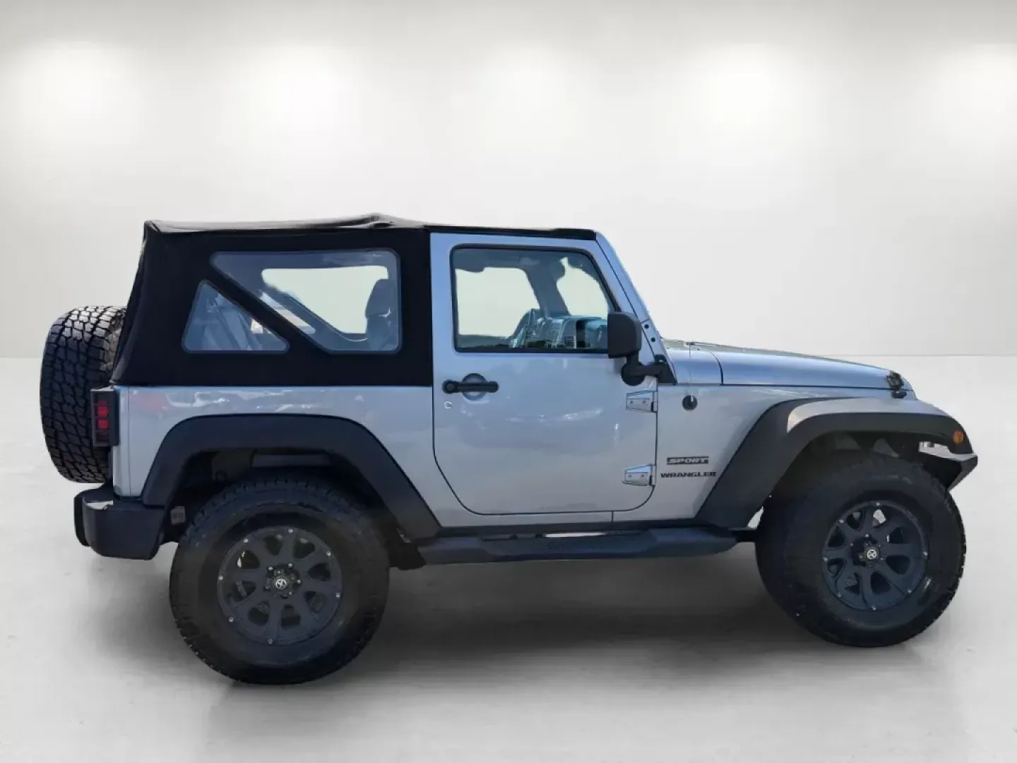 2014 /Black Jeep Wrangler Sport (1C4AJWAG7EL) with an Regular Unleaded V-6 3.6 L/220 engine, 5-Speed Automatic w/OD transmission, located at 1430 Gateway Drive, Opelika, AL, 36801, (334) 239-0944, 32.637871, -85.409790 - 2014 Jeep Wrangler Sport - Photo#3