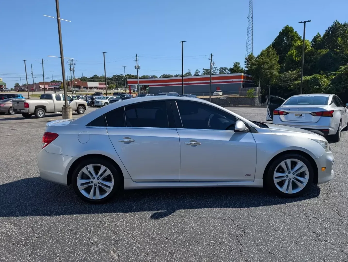 2015 /Jet Black Chevrolet Cruze LTZ (1G1PG5SB8F7) with an Other engine, located at 3959 U.S. 80 W, Phenix City, AL, 36870, (334) 297-4885, 32.469296, -85.135185 - **Discover Unmatched Style and Comfort with the 2015 Chevrolet Cruze LTZ at Gils Auto!**<br /> <br /> Are you in search of a reliable vehicle that fits seamlessly into your daily life? The 2015 Chevrolet Cruze LTZ is the perfect sedan for anyone seeking a stylish ride that excels in efficiency and c - Photo#1