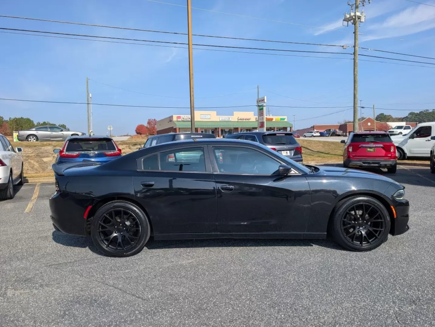 2015 /Black Dodge Charger SE (2C3CDXBG1FH) with an Other engine, located at 3959 U.S. 80 W, Phenix City, AL, 36870, (334) 297-4885, 32.469296, -85.135185 - **Unleash Your Drive with the 2015 Dodge Charger SE - Perfect for Every Journey!**<br /> <br /> Are you looking for a vehicle that makes every drive an adventure? Look no further than this striking 2015 Dodge Charger SE, available now at Gils Auto in Phenix City, AL! Whether you're commuting to work - Photo#3